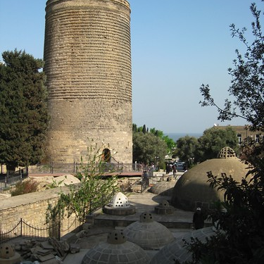 The Maiden Tower of Baku was built in the cylindrical form on the giant rock inclined towards the coast of the Caspian Sea. An oblong support (buttress) is attached to it from the seaside. The height of the tower on the northern part is 31 m, on the south- 28 m. The diameter of the tower on the first floor is 16.5 m. The thickness (width) of the wall on the first floor is up to 5 m. The interior part of the tower is divided into 8 floors. Each floor is covered with the arched ceiling made of cut stone. There are round holes in the middle of the stone ceilings. The holes are vertical. Thus when you look through the round holes in the middle of the 8 storey ceiling you can see the floor of the first storey. The single entrance to the tower is the arched doorway in its western part 2 m in height and 1.10 m in width.  The height of the first floor of the tower is 3 m, the average height of the other floors is 2.5 m.